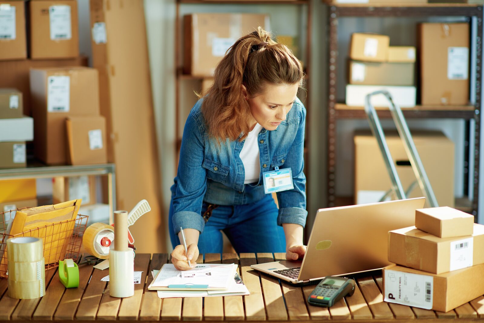 Seller preparing parcels for delivery after a live sale